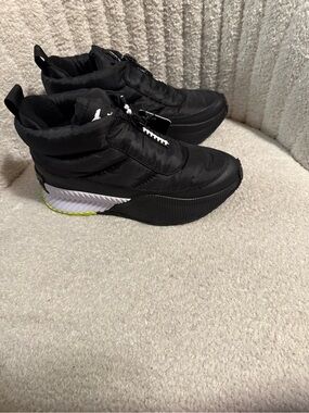 Sorel Black Quilted Slip-On Sneakers with White & Neon Yellow Accent
